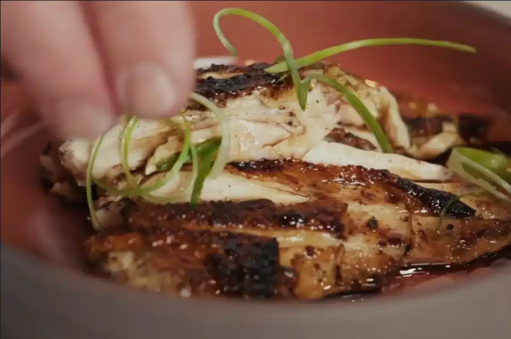 Grilled Aurum Cockerel breast with caramelised skin, sliced and dressed with soy and green shallots