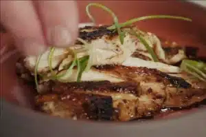 Grilled Aurum Cockerel breast with caramelised skin, sliced and dressed with soy and green shallots