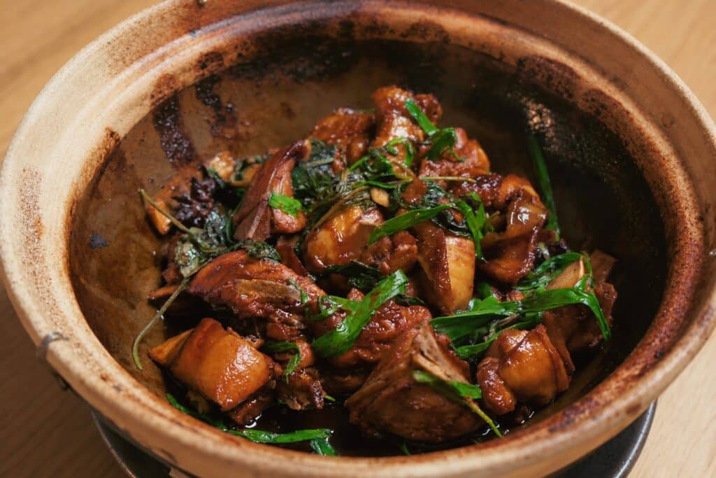 Nan Yang 3 cup Aurum Cockerel glazed in a claypot with shiso and garlic chives